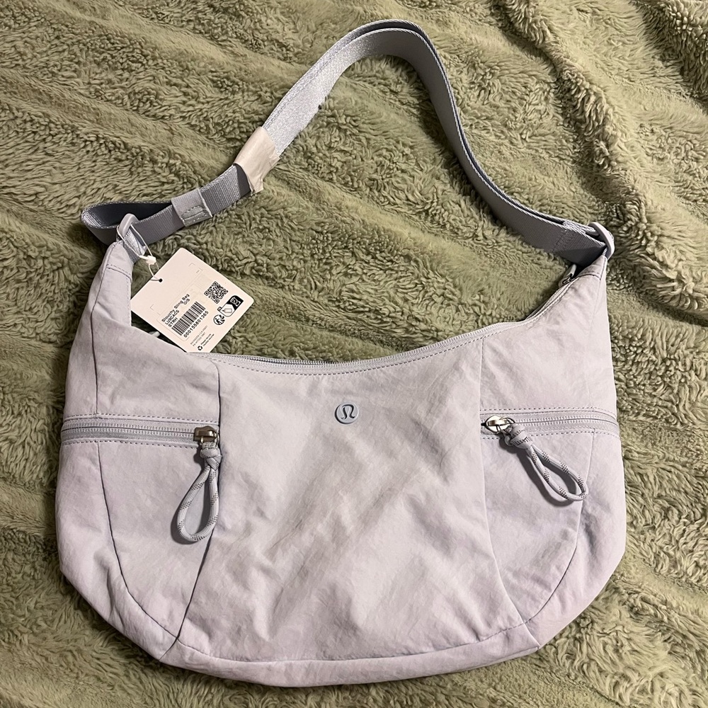 Lululemon Athletica Slouchy Sling Bag in Soft blue